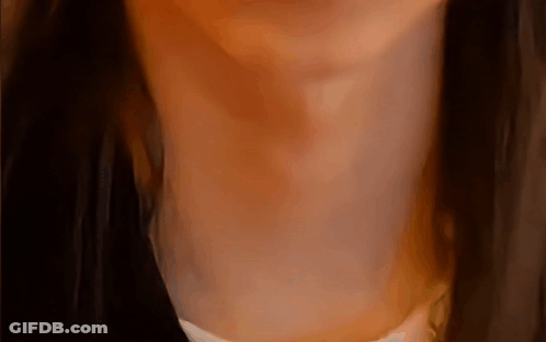 A Close Up Of A Woman 'S Neck And Chest GIF