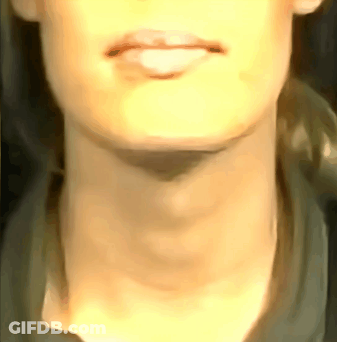 A Close Up Of A Woman 'S Neck With A Shadow On It GIF