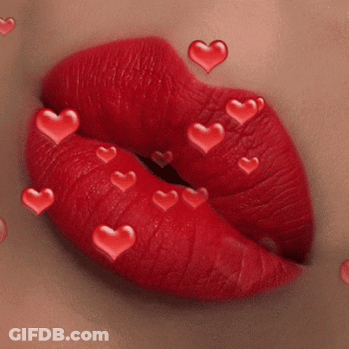 A Close Up Of A Woman 'S Red Lips With Red Hearts Coming Out Of Them GIF