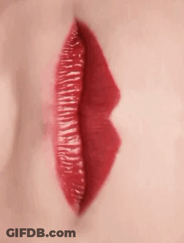 A Close Up Of A Woman 'S Red Lips With Red Lipstick . GIF