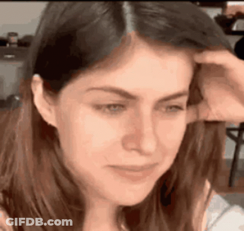 A Close Up Of A Woman Scratching Her Head . GIF
