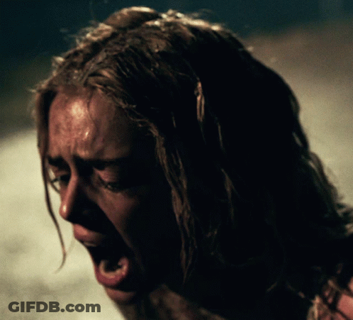 A Close Up Of A Woman Screaming With Her Mouth Wide Open GIF