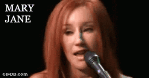 Woman Singing Into Microphone Mary Jane Behind GIF