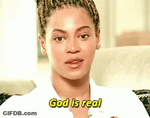 A Close Up Of A Woman Sitting On A Couch Talking About God Is Real . GIF