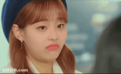 A Close Up Of A Woman Wearing A Beret And Making A Funny Face GIF