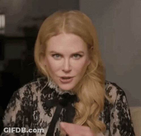 A Close Up Of A Woman Wearing A Black And White Lace Dress . GIF