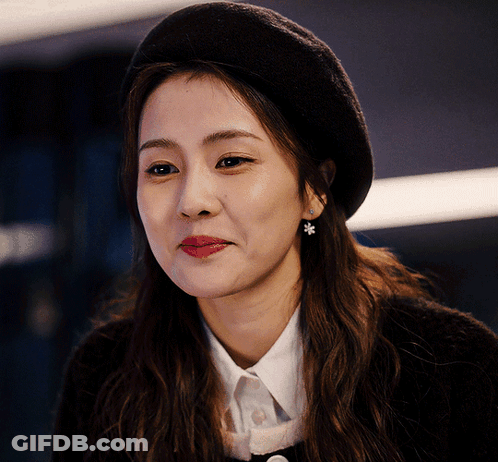 A Close Up Of A Woman Wearing A Black Beret GIF