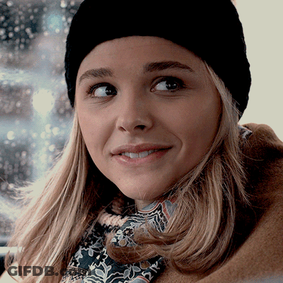 A Close Up Of A Woman Wearing A Black Hat GIF