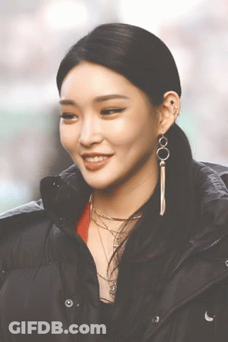 A Close Up Of A Woman Wearing A Black Jacket GIF