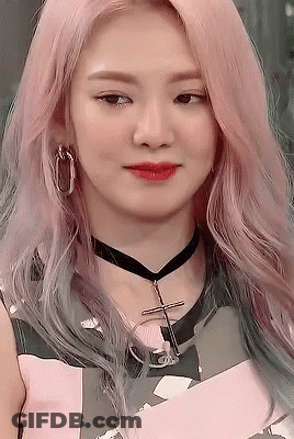A Close Up Of A Woman Wearing A Choker And Earrings . GIF