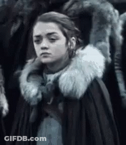 A Close Up Of A Woman Wearing A Fur Coat . GIF