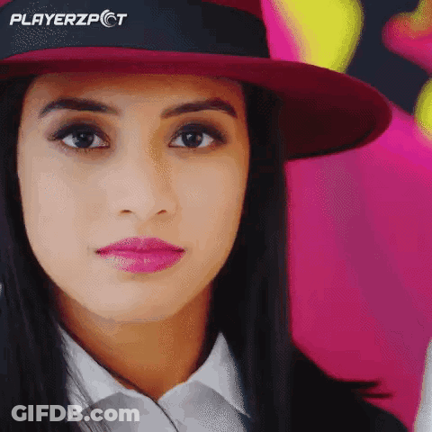A Close Up Of A Woman Wearing A Hat With Playerzpct On It GIF