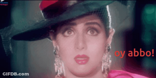 A Close Up Of A Woman Wearing A Hat With The Words Oy Abbo In Red GIF