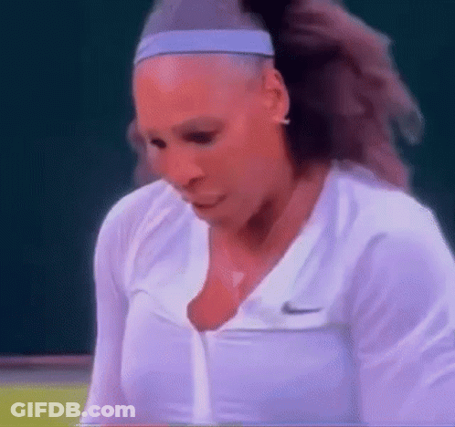 A Close Up Of A Woman Wearing A Headband And A White Shirt . GIF