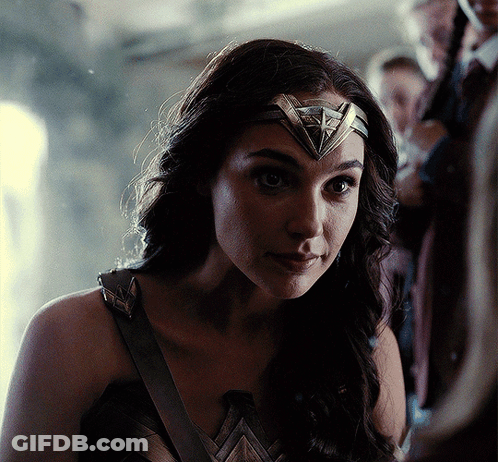 A Close Up Of A Woman Wearing A Headband With A Triangle On It GIF