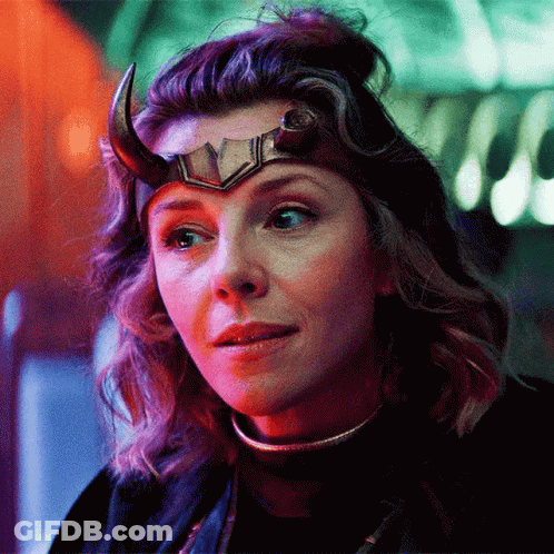 A Close Up Of A Woman Wearing A Horned Helmet . GIF