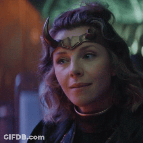 A Close Up Of A Woman Wearing A Horned Helmet GIF