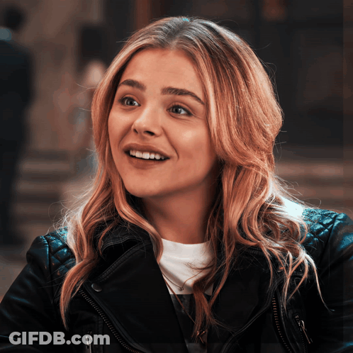 A Close Up Of A Woman Wearing A Leather Jacket GIF
