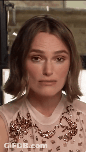 A Close Up Of A Woman Wearing A White Dress GIF