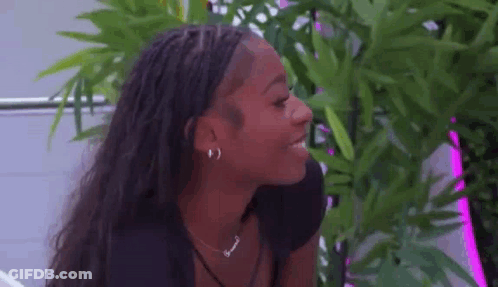 A Close Up Of A Woman Wearing Earrings And A Necklace . GIF