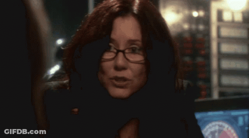 Woman Wearing Glasses And Badge Close Up GIF