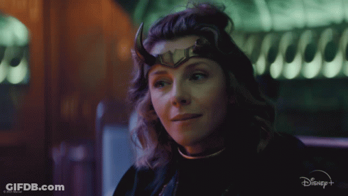 A Close Up Of A Woman Wearing Horns And A Disney Logo GIF