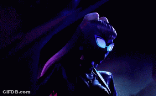 A Close Up Of A Woman Wearing Sunglasses And A Choker . GIF