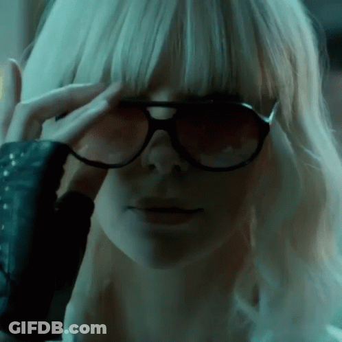 A Close Up Of A Woman Wearing Sunglasses Covering Her Eyes GIF