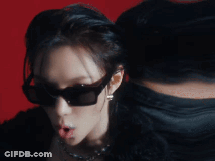 A Close Up Of A Woman Wearing Sunglasses GIF
