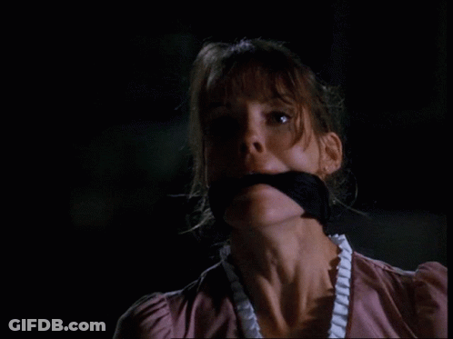 A Close Up Of A Woman With A Black Bandage Around Her Mouth GIF
