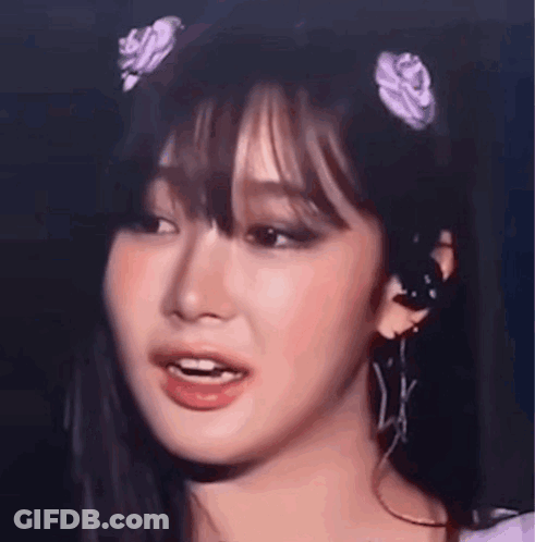 Close Up Of Woman With Flower In Hair GIF