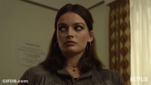 A Close Up Of A Woman With A Netflix Logo On The Bottom GIF