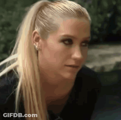 A Close Up Of A Woman With Blonde Hair In A Ponytail GIF