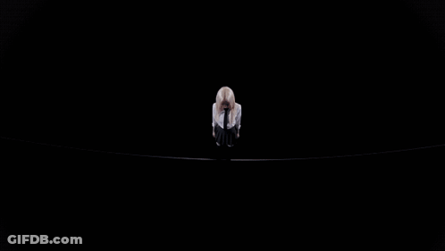 A Close Up Of A Woman With Blonde Hair Looking Down GIF