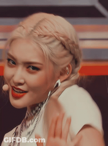 A Close Up Of A Woman With Blonde Hair Wearing Red Lipstick GIF