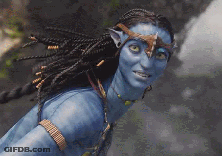 A Close Up Of A Woman With Blue Paint On Her Face And Braids . GIF