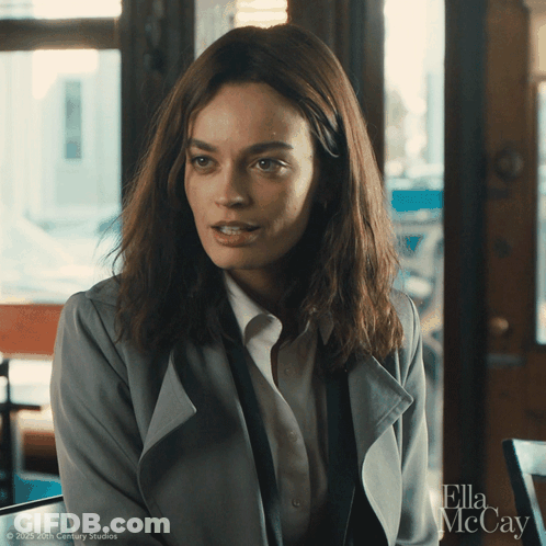 A Close Up Of A Woman With Ella Mccay Written On The Bottom Right GIF