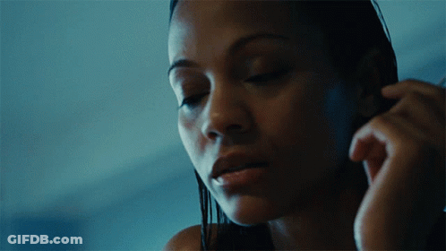 A Close Up Of A Woman With Her Eyes Closed GIF