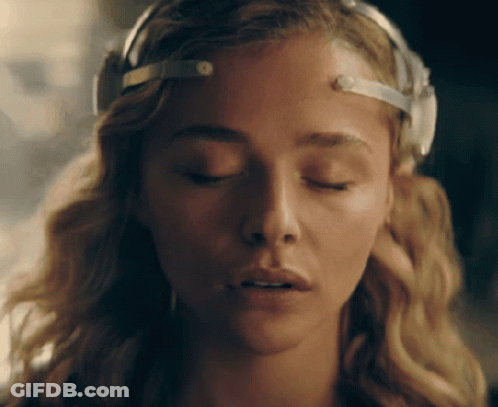 A Close Up Of A Woman With Her Eyes Closed And A Headband On Her Head GIF