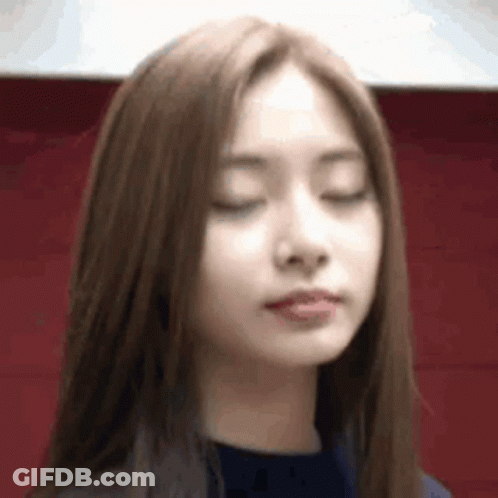 A Close Up Of A Woman With Her Eyes Closed And Her Mouth Open . GIF
