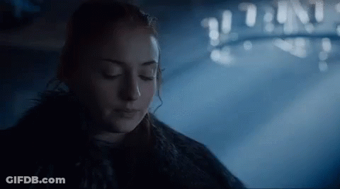 A Close Up Of A Woman With Her Eyes Closed In A Dark Room . GIF