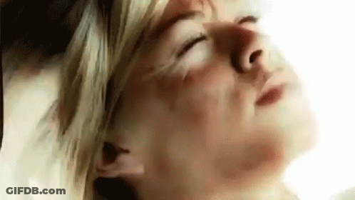 A Close Up Of A Woman With Her Eyes Closed . GIF