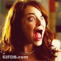 A Close Up Of A Woman With Her Mouth Open And Her Tongue Out GIF