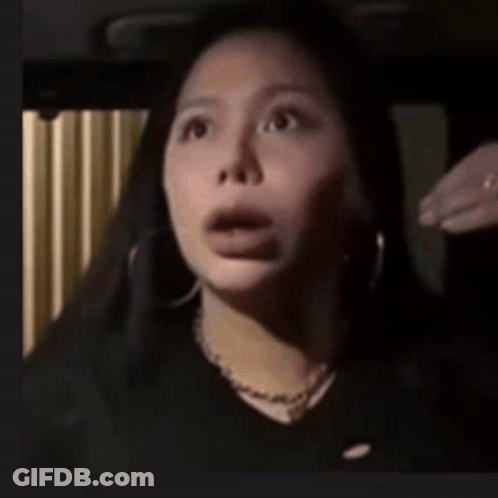 A Close Up Of A Woman With Her Mouth Open GIF
