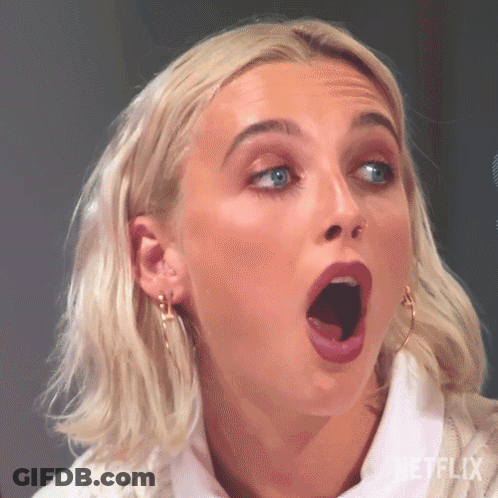 A Close Up Of A Woman With Her Mouth Open . GIF