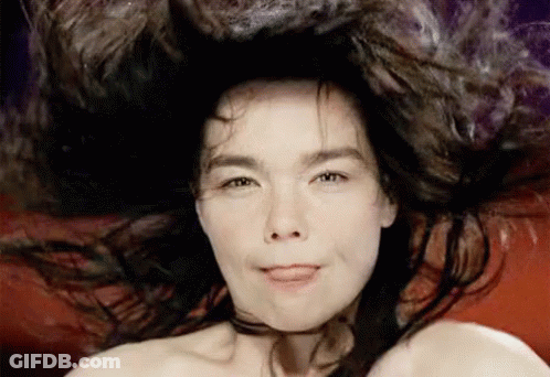 A Close Up Of A Woman With Her Tongue Out GIF