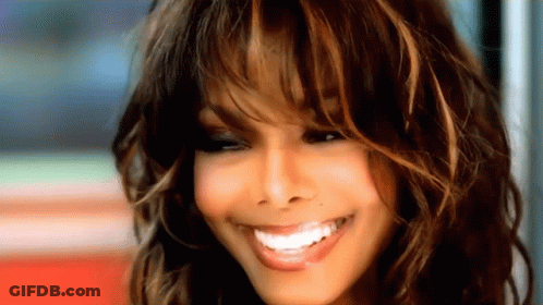 A Close Up Of A Woman With Long Hair Smiling GIF