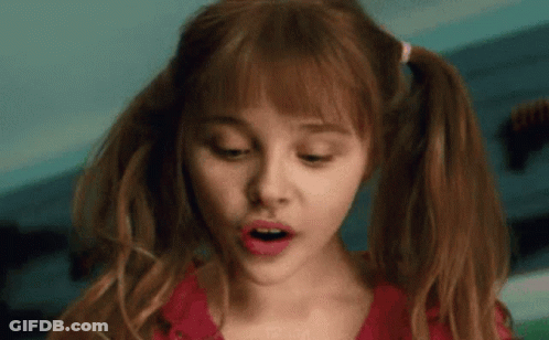 A Close Up Of A Woman With Pigtails And A Surprised Look On Her Face GIF