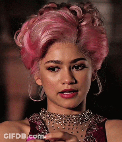 A Close Up Of A Woman With Pink Hair GIF