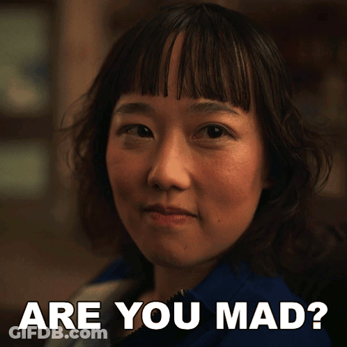 A Close Up Of A Woman With The Words " Are You Mad " Above Her GIF